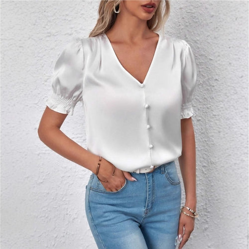 Dame satengbluse med pufferm og elegant knappeliste Skjora